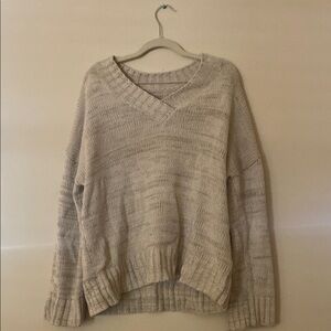 Cream V-Neck Sweater with Elegant Design
